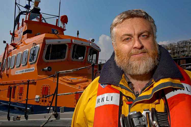 Tim Mock in front of Exmouth RNLI Trent Class 14-12 Forward Birmingham  Credit : Neil Palmer