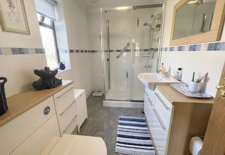 The master bedroom has its own en-suite shower room/WC, and there is another modern bathroom. Credit: Whitton & Laing