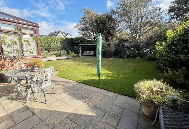 Outside, there is a large private garden to the rear with a timber shed, sun terrace and decking. Credit: Whitton & Laing