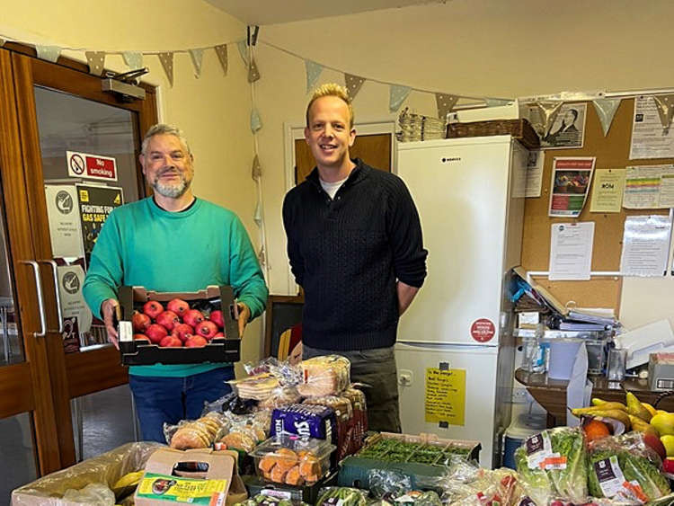 Cllr Bruce de Saram and Rev Sam Burnett inside Littleham Community Fridge in Bidmead Community Centre