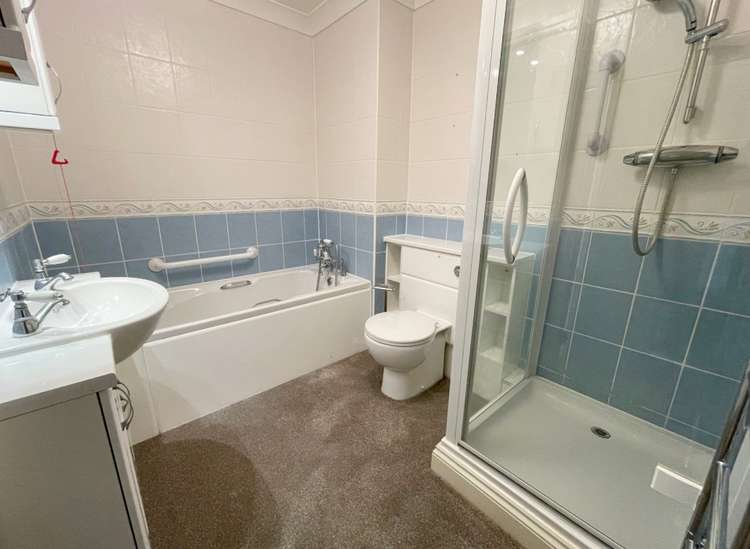 The bathroom features a bath and a separate shower. Credit: Whitton & Laing