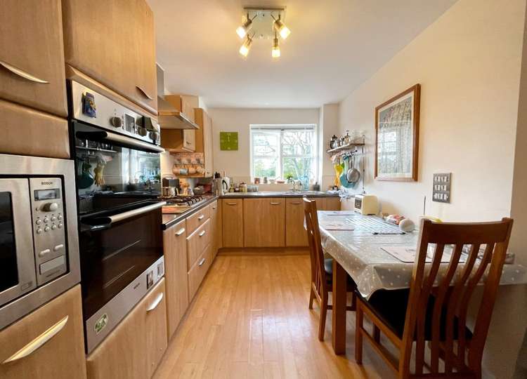 The kitchen has a range of built-in appliances