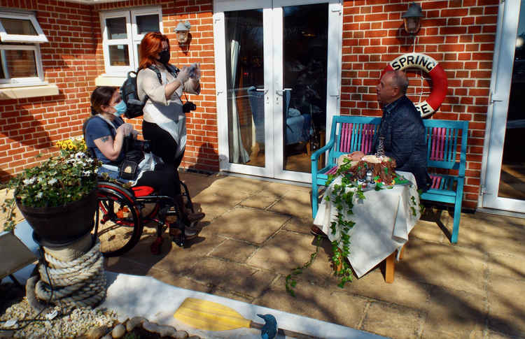 Photo-journalist Lisa (far left) interviewing Felixstowe Radio's Rob Dunger