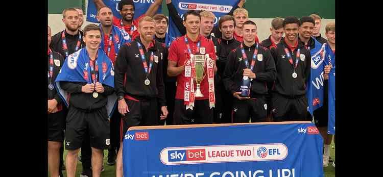 Crewe players celebrate promotion