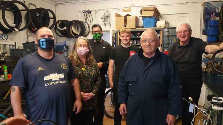 Director Annette Cormack (second left) with (L-R) Les Robinson, Benji Woods, Tom Buckley, Dave Sproston and Dave Williams at Community Recycle Cycles.