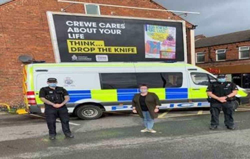 (L to r) PC Tom Towe, competition organiser Rachel Dyer and PC Tim Clark in front of the new billboard.