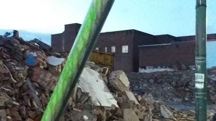 Only piles of rubble remain of the shopping row.