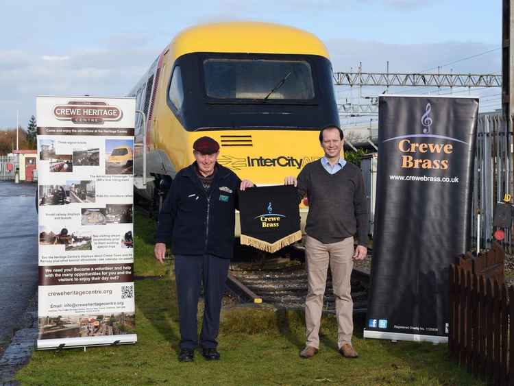 Gordon Heddon, Chairman, Crewe Heritage Centre, and Matt Pithers, Musical Director, Crewe Brass in front of APT at Crewe Heritage Centre