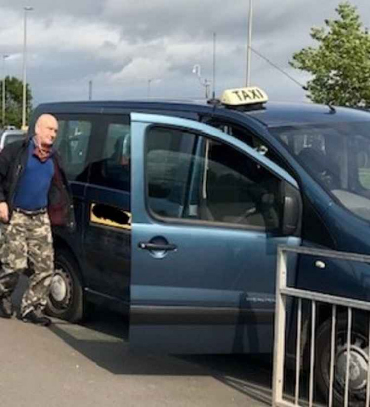 Brian Kent gets into his taxi at Crewe Railway Station after the racist incident.