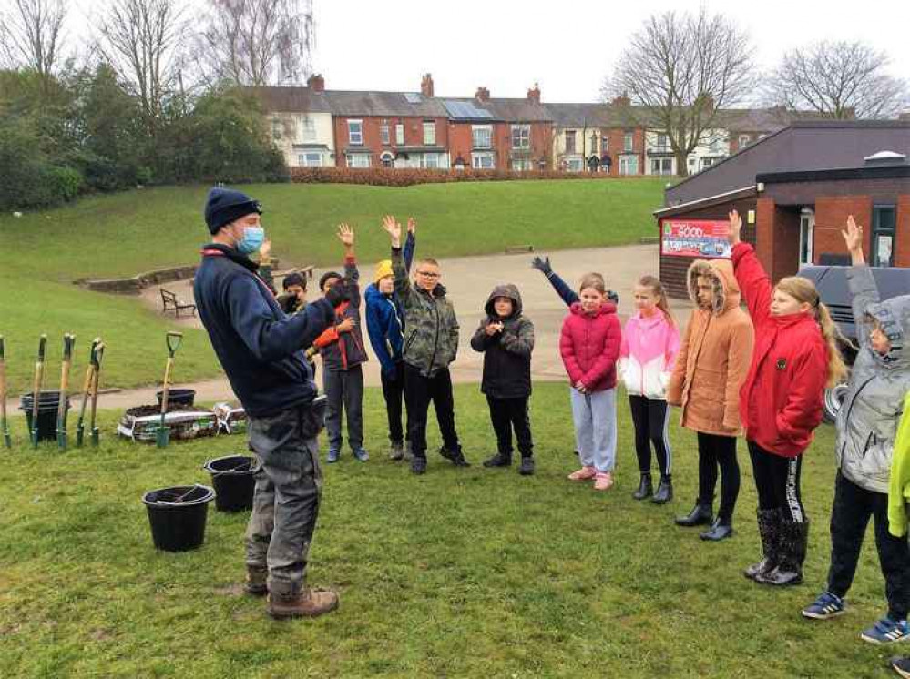 School children helped the planting effort.