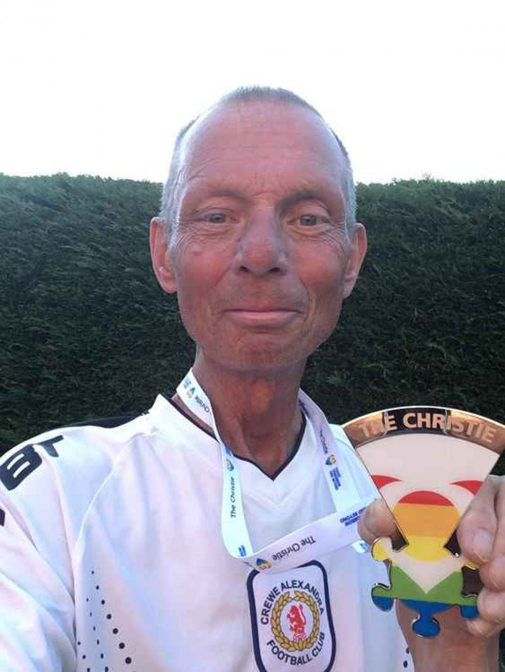 Andy Scoffin with his Christie charity medal.