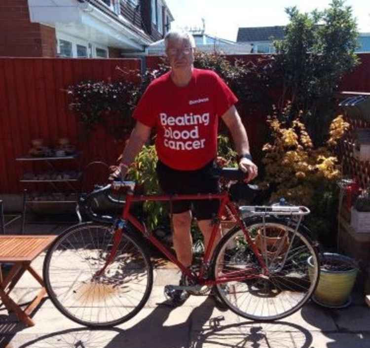 Fundraiser Ben Reinhardt and his bike. (Photo with permission of Ben Reinhardt)