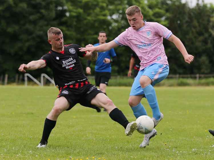 Calm 84 FC Crewe player Fred (pink shirt) fights for the ball (Image: Jonathan White)