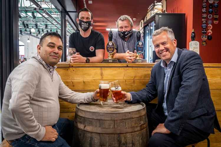 Chamber Chief Executive Paul Colman (right) and Market Hall Events Manager Chris McCaughran enjoy craft beer at The Crewe Dog.