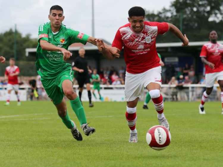 The Alex's Travis Johnson comes under pressure from Carlos Montefiori (Picture: Jonathan White).