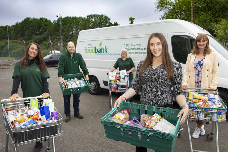 Anwyl recently donated to two Cheshire Foodbanks including Middlewich Food Bank and West Cheshire Food Bank. Pictured (front right) Anwyl sales manager Sophie Jones, with food bank volunteers.