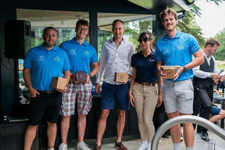 Winners of the Swanky Swing golf tournament, Langricks, presented with their prizes by Natalie Collins from TorFX.