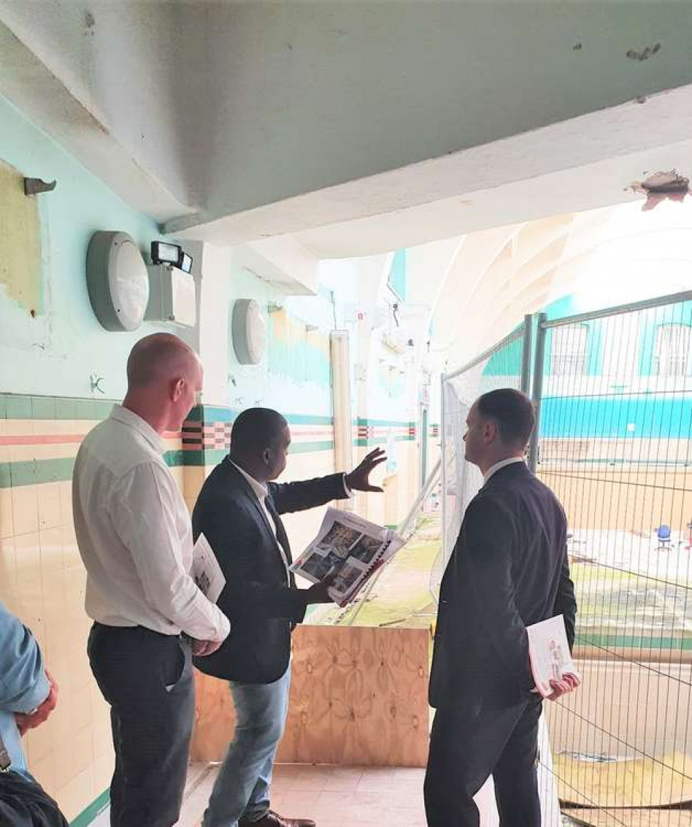 MP Kieran Mullan (left) with Aways Ahead CEO, Rev David Edwards (centre) and Minister Luke Hall inside the former Flag Lane Baths this week.