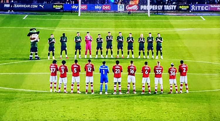 Crewe and Plymouth players pay tribute to the NHS before kick off.