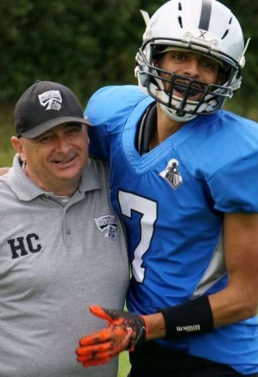 Head Coach Jason Smith (left) celebrates with Hus Roberts.