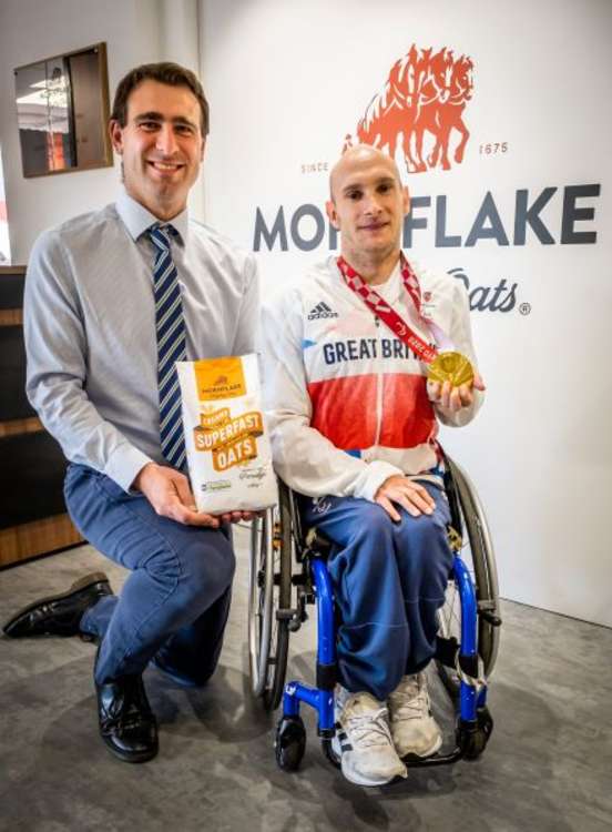 Mornflake Managing Director James Lea welcomes Paralympic gold medallist Andy Small to the firm's new shop.