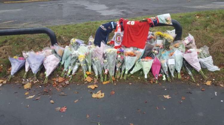 Floral tributes and mementoes have been laid near to the scene of the collision in Macon Way.