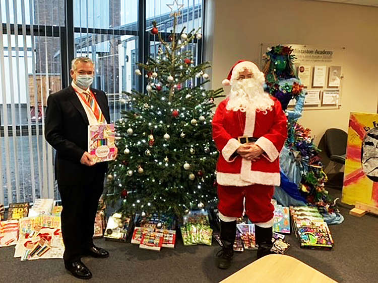 Swansway director David Smyth pictured with Santa.