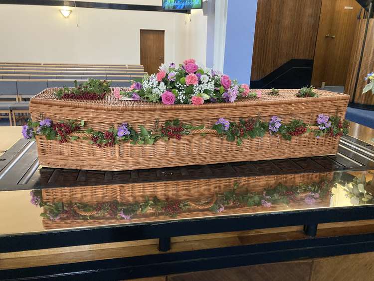 A wicker coffin has a touch of class.