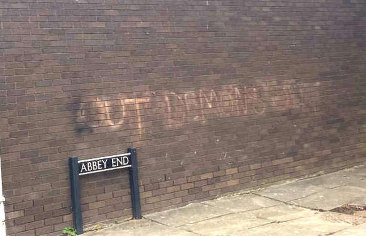 The clean up will begin by removing 'out demons out' sprayed on the wall next to Forrest