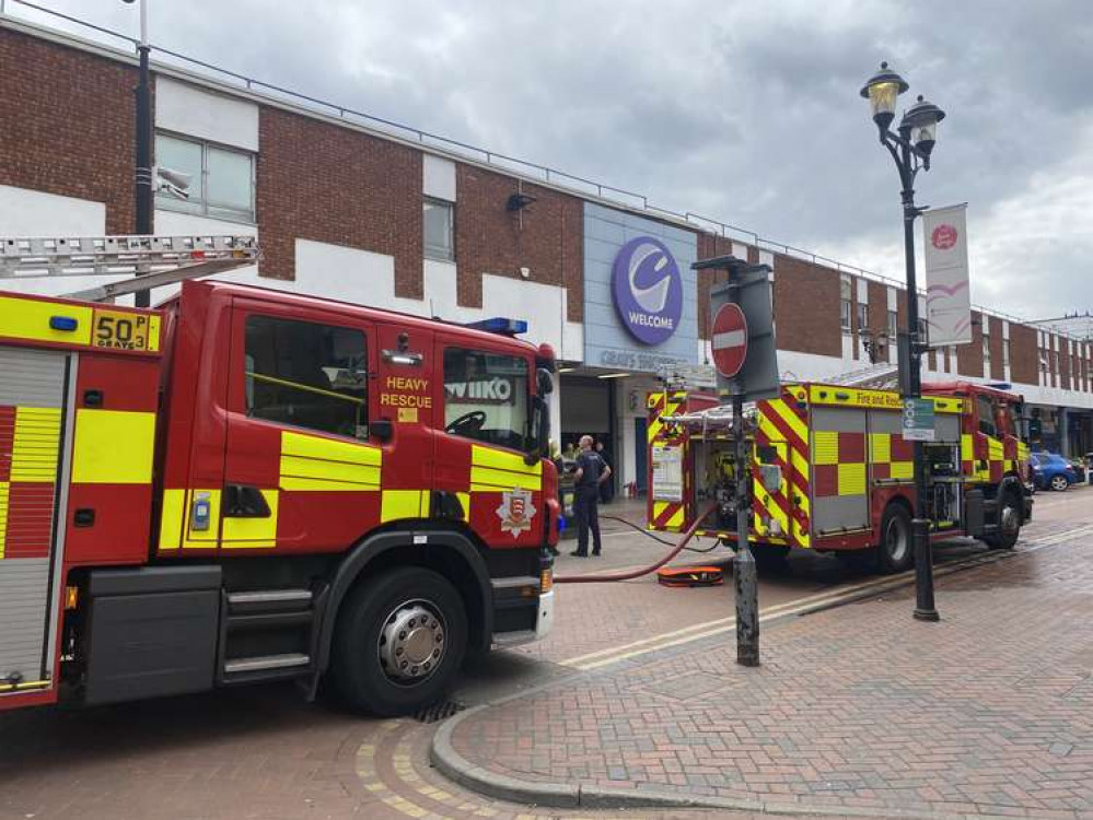 Firefighters outside Grays Shopping Mall.