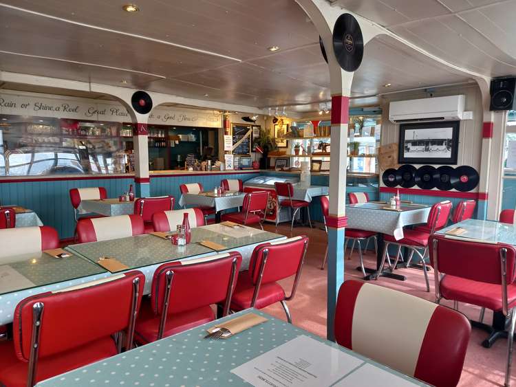 Clean and character filled counter and tables at the Ferry Cafe