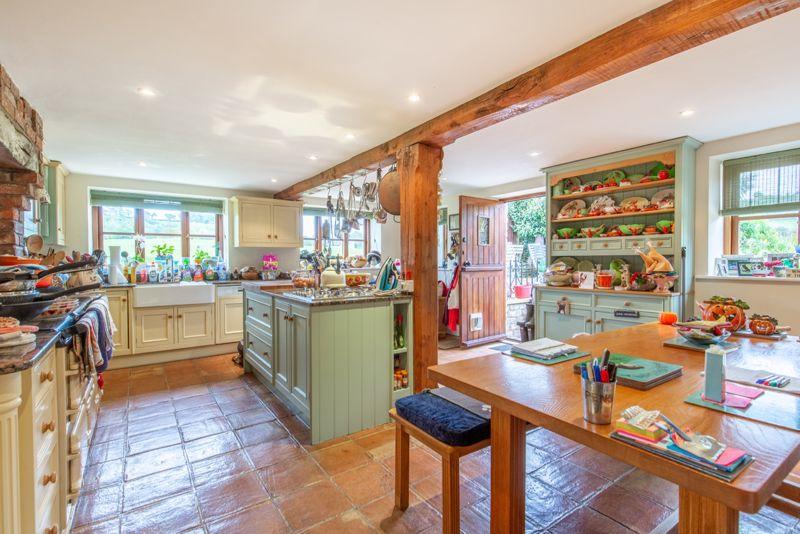 The farmhouse-style kitchen is lovely and spacious