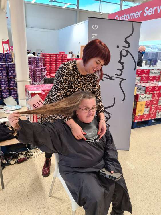 Going, going, hone: Wendy in the hot seat having her hair cut