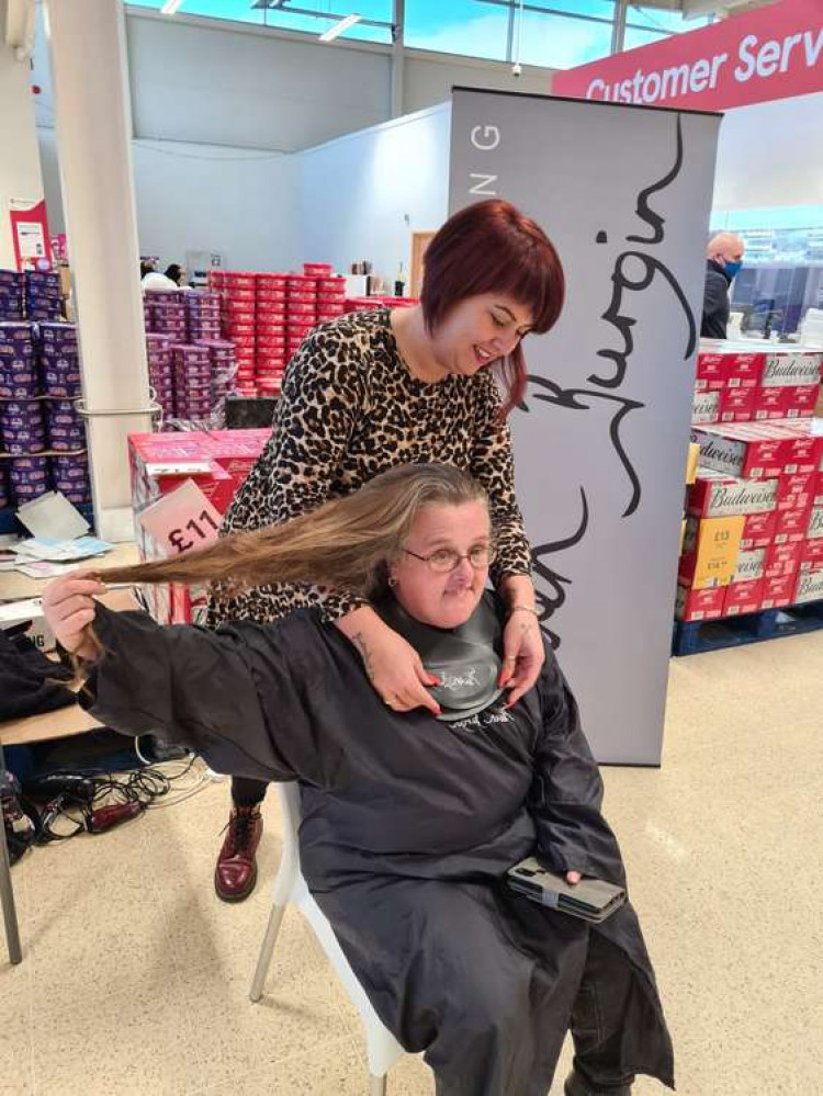 Going, going, hone: Wendy in the hot seat having her hair cut