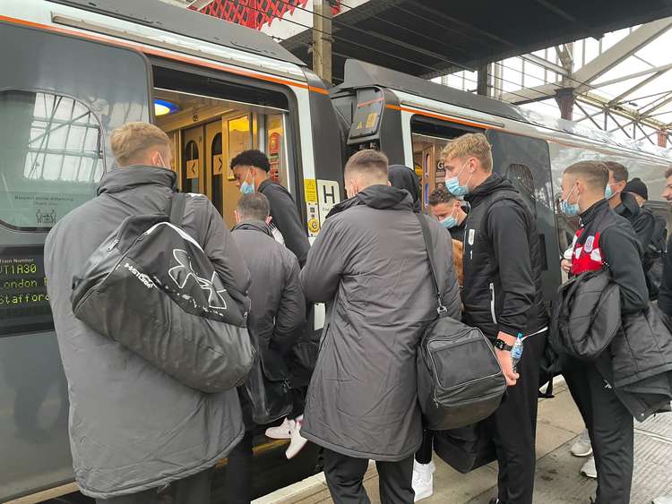 The Crewe Alex players board their coach at Crewe Station today.