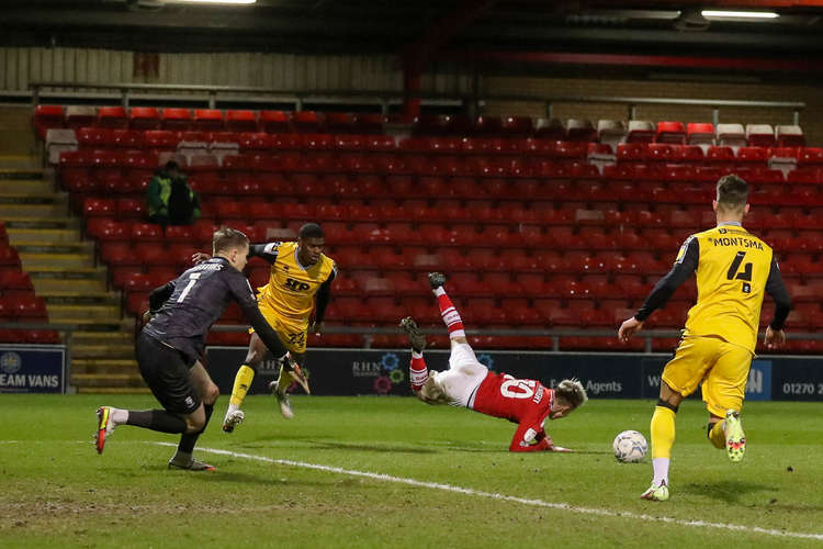 Ben Knight is sent sprawling for Crewe's second penalty award.