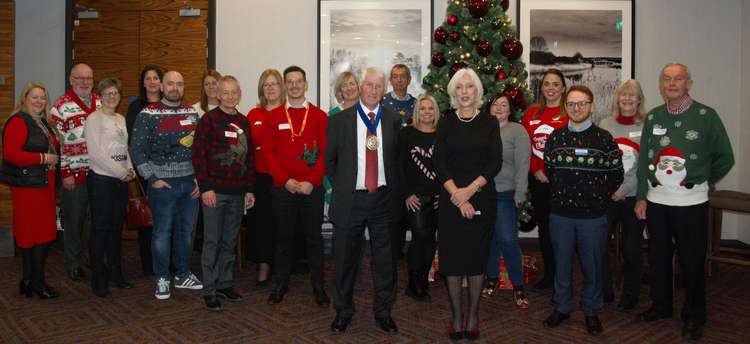Feeling festive: South Cheshire Chamber of Commerce President John Dunning and Chair Diane Wright (centre) with business members