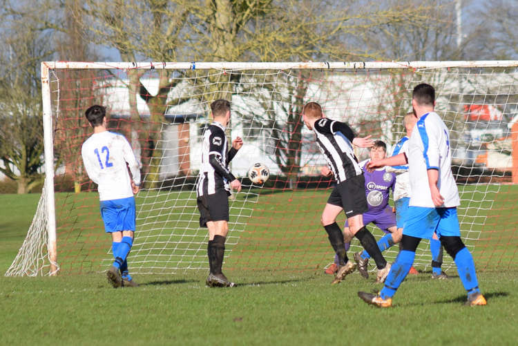 Cooper Buckley (black and white stripes) on the attack against Nantwich Pirates (Picture: Jonathan White).