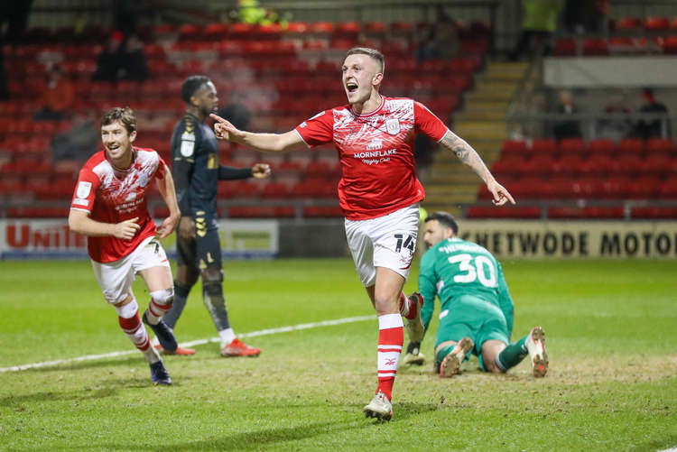 Oli Finney celebrates the opener (Picture credit: Kevin Warburton).