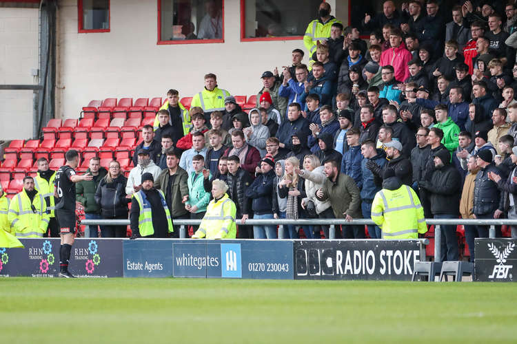 Rotherham captain Richard Wood pleads with away fans after official Paul Stonier was hit by a coin (Picture credit: Kevin Warburton).