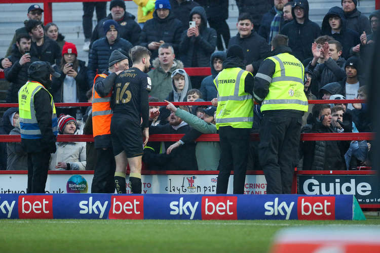 Luke Murphy reasons with angry Alex fans at the final whistle (Picture credit: Kevin Warburton).