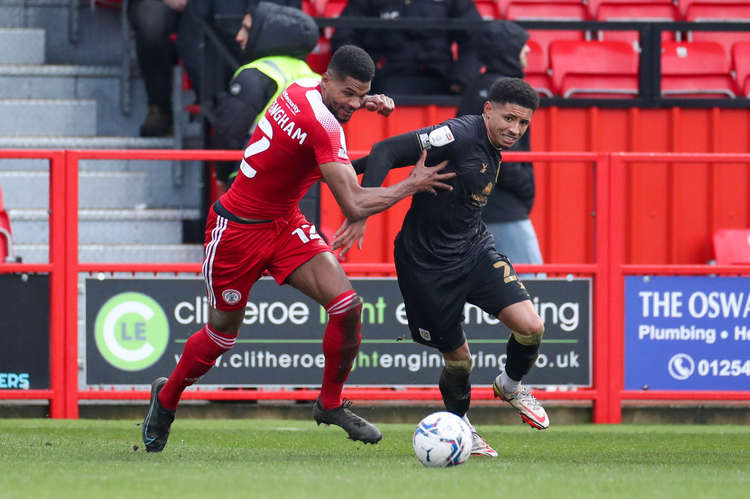 Travis Johnson takes on former Alex loanee Michael Nottingham (Picture credit: Kevin Warburton).