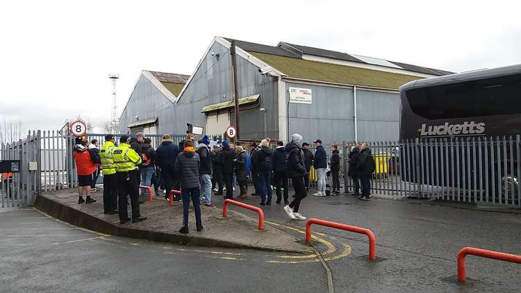 Disappointed Pompey fans gather outside the Mornflake Stadium.