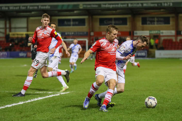 Regan Griffiths fighting for the ball as Connor O'Riordan watches on (Picture credit: Kevin Warburton).