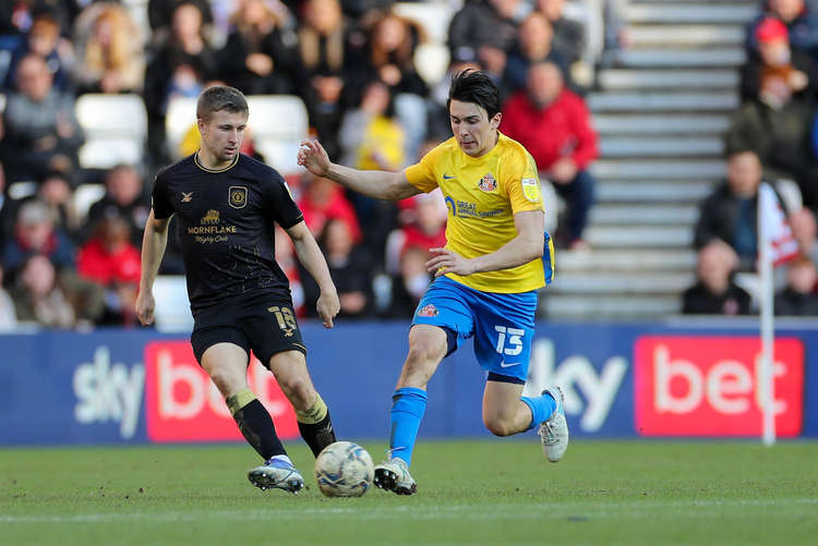 Regan Griffiths (left) is challenged by Sunderland's Luke O'Nien (Picture credit: Kevin Warburton).