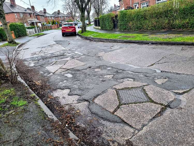 The neglected road surface on Frank Bott Avenue, Crewe