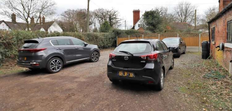 There are transferrable parking rights for 2 vehicles at the back of the property.