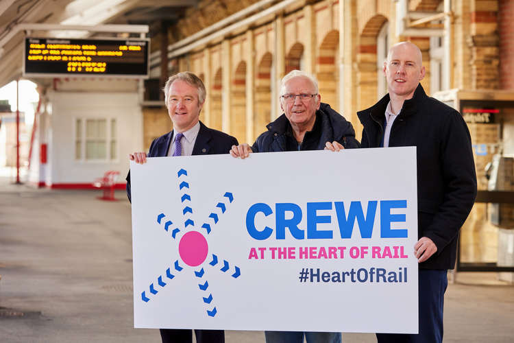 Cllr Sam Corcoran, Pete Waterman OBE and MP Kieran Mullan at Crewe Train Station.