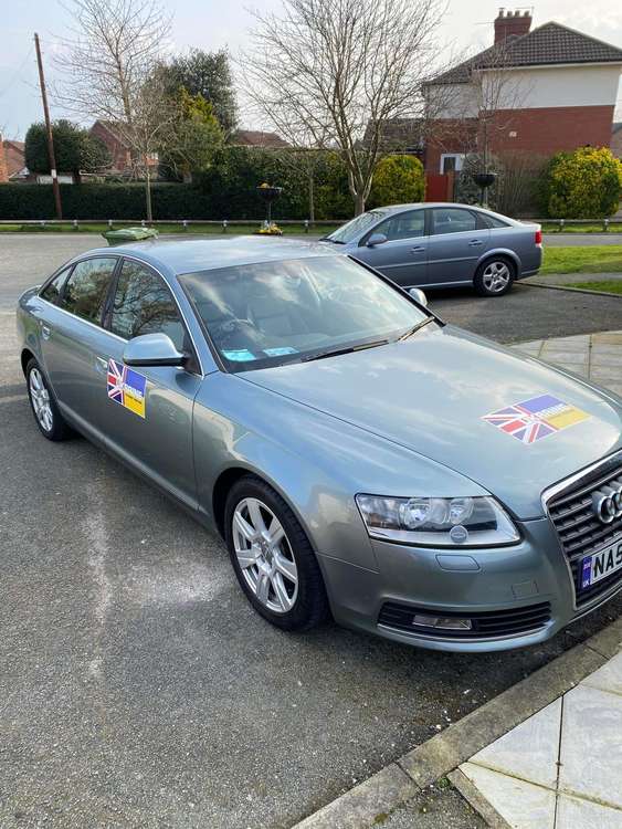 Stephen's car has labels on to notify people of his mission for Ukraine