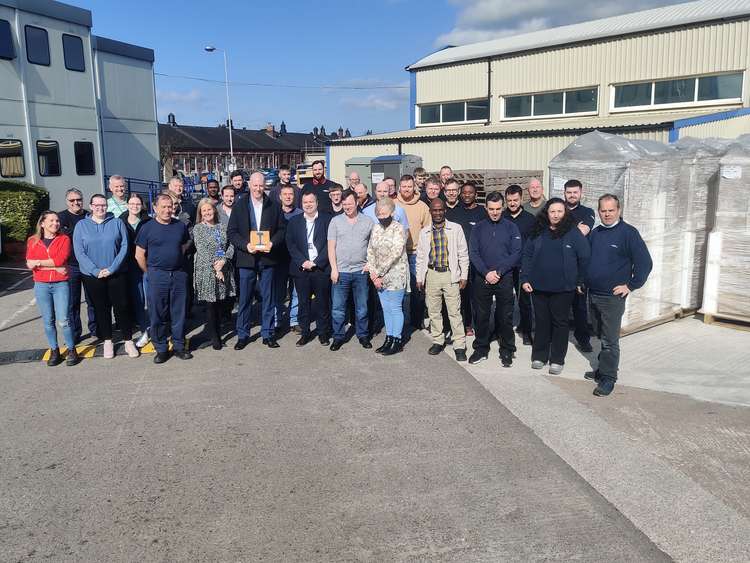 Crewe MP Dr Kieran Mullan with the award with workers and supporters at Unipart Rail, Gresty Road, Crewe.